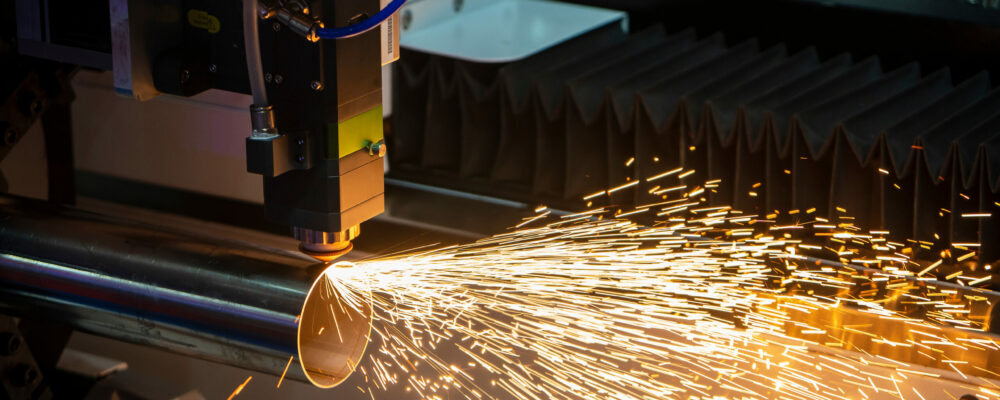 The fiber laser cutting machine cutting the stainless steel tube The fiber laser cutting machine cutting the stainless steel tube control by CNC program. The sheet metal working processing by laser cutting machine make the engrave at the stainless steel pipe parts.